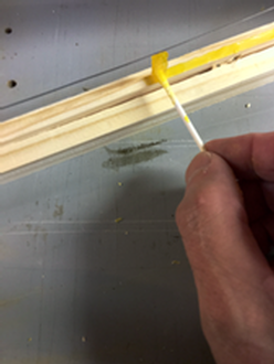 Apllying wax with cotton swab